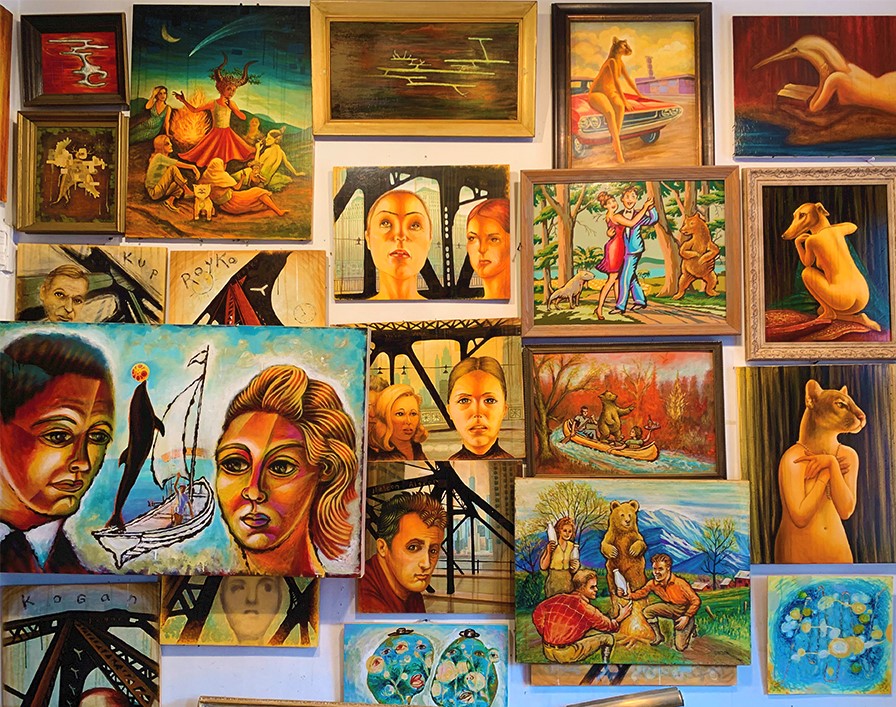 collage of paintings on wall