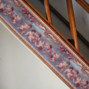 "cherub" wallpaper lines a staircase