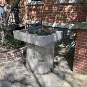sculpture of a pile of dung on a pedestal -- titled "Shit Fountain"