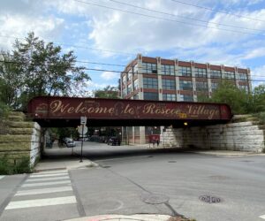 "Welcome to Roscoe Village" sign on viaduct
